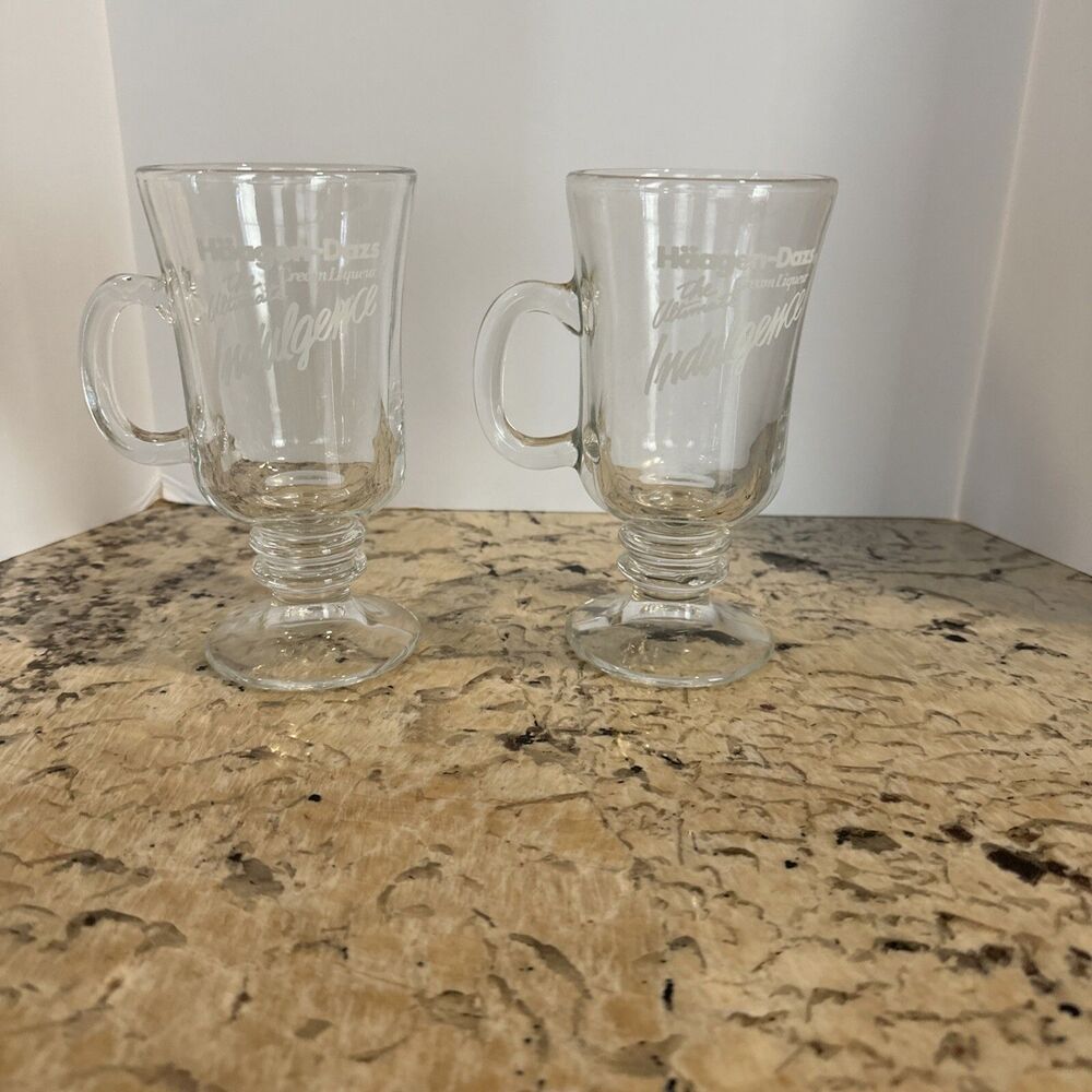 Pair of Haagen-Dazs Ultimate Indulgence Oz Clear Glass Irish Coffee Mugs